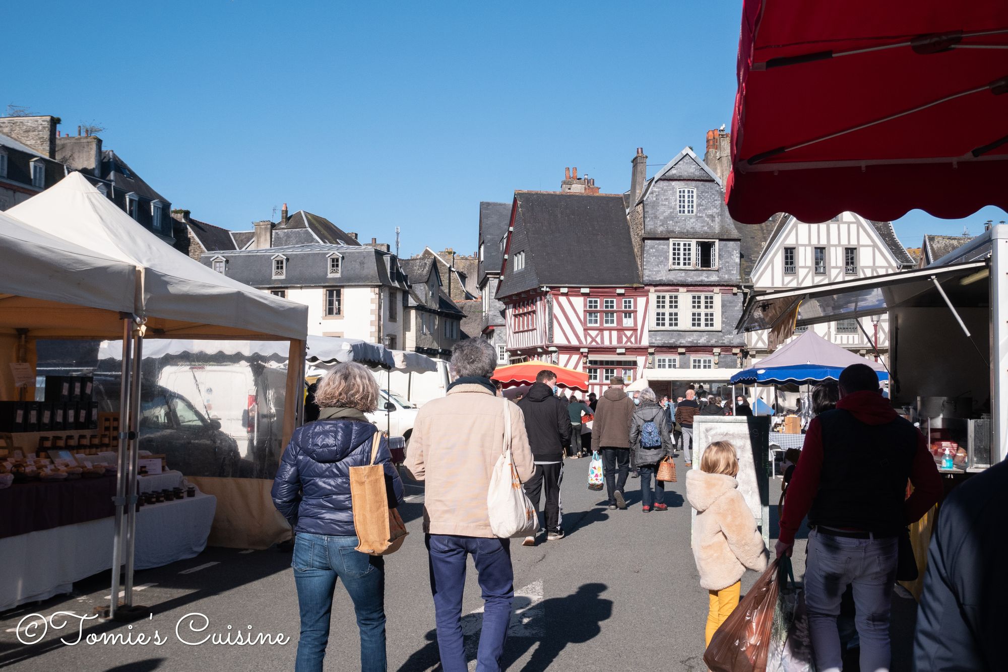 Fruit Stall With People Buying At Morlaix Weekly Market France