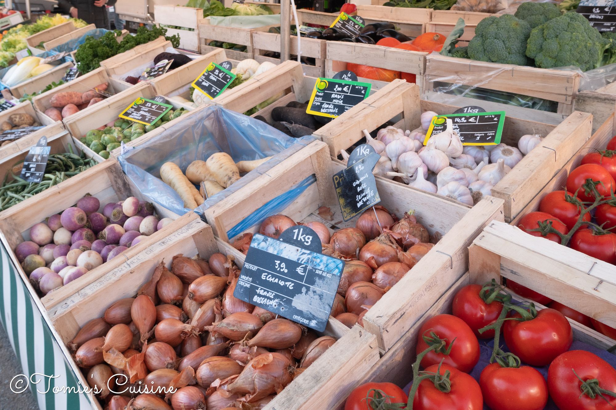 Fruit Stall With People Buying At Morlaix Weekly Market France