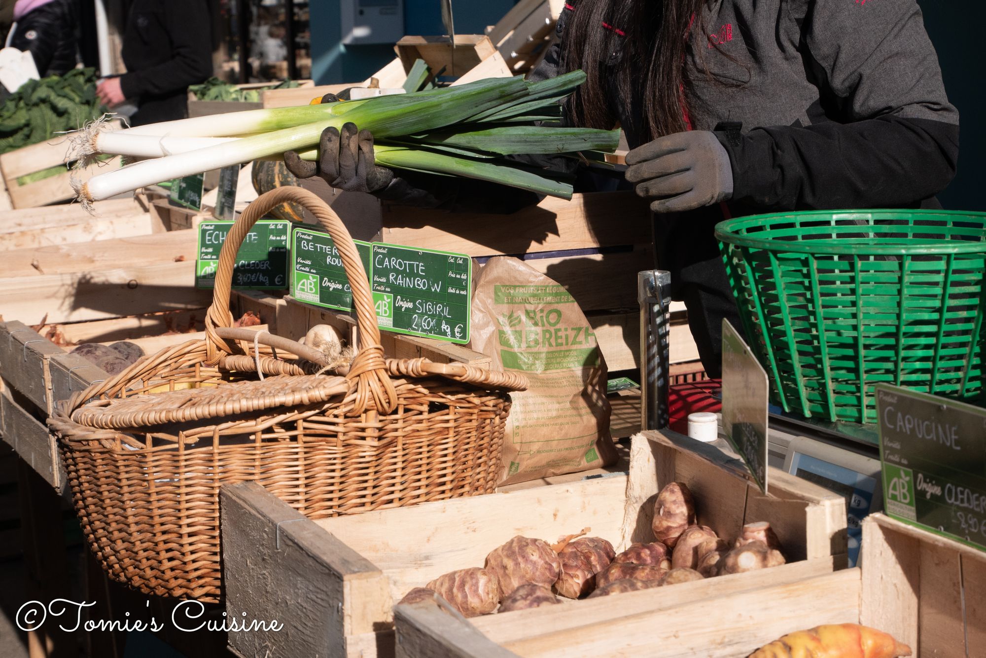 Fruit Stall With People Buying At Morlaix Weekly Market France